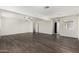 Spacious living room boasts wood flooring, natural light, and neutral decor at 554 N Sunset Dr, Chandler, AZ 85225