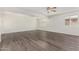 Spacious room featuring dark wood flooring, recessed lighting and bright windows at 554 N Sunset Dr, Chandler, AZ 85225