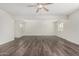 Large living room showcasing wood floors, neutral walls, recessed lights and bright windows at 554 N Sunset Dr, Chandler, AZ 85225