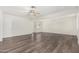 Bright living room features a ceiling fan, recessed lighting, and wood-look floors at 554 N Sunset Dr, Chandler, AZ 85225