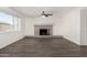 Spacious living room featuring sleek floors, a cozy fireplace, and tons of natural light at 554 N Sunset Dr, Chandler, AZ 85225