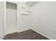 Empty room features wood flooring, a closet, and floating shelves at 554 N Sunset Dr, Chandler, AZ 85225