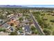 Stunning aerial view of the community, featuring well-maintained streets, lush landscaping, and a beautiful park nearby at 5612 E Emile Zola Ave, Scottsdale, AZ 85254
