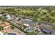Aerial view showcasing the property, pool, manicured landscaping and surrounding neighborhood at 5612 E Emile Zola Ave, Scottsdale, AZ 85254