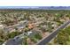 Panoramic aerial view of the neighborhood with tree-lined streets, manicured lawns, and stunning mountain views at 5612 E Emile Zola Ave, Scottsdale, AZ 85254