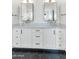 Bathroom featuring a double vanity, black hexagon tile floor, and modern fixtures at 5612 E Emile Zola Ave, Scottsdale, AZ 85254
