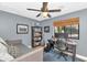 Comfortable bedroom with a trundle daybed, bookshelves, desk, and ample natural light at 5612 E Emile Zola Ave, Scottsdale, AZ 85254