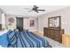 Bedroom featuring a wooden dresser and a sliding barn door that leads into the bathroom at 5612 E Emile Zola Ave, Scottsdale, AZ 85254