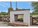 Picturesque outdoor fireplace with brick detailing, adding warmth and charm to the outdoor living space at 5612 E Emile Zola Ave, Scottsdale, AZ 85254
