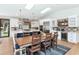 Open-concept kitchen and dining area with wood floors, skylights, and a large island at 5612 E Emile Zola Ave, Scottsdale, AZ 85254