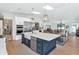 Bright kitchen featuring a spacious island, stainless appliances, and plenty of countertop space at 5612 E Emile Zola Ave, Scottsdale, AZ 85254