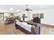 Open-concept living area with wood floors, skylights, and a view into the modern kitchen at 5612 E Emile Zola Ave, Scottsdale, AZ 85254