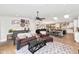 Bright and airy living room with wood floors and seamless access to the dining and kitchen areas at 5612 E Emile Zola Ave, Scottsdale, AZ 85254