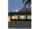 Lovely home at nighttime, featuring a well maintained yard and illuminated exterior under the moonlight at 5625 N 45Th St, Phoenix, AZ 85018