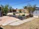 Backyard with brick planter boxes, a metal storage shed, and grass at 6011 N 33Rd Ave, Phoenix, AZ 85017
