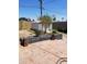 Backyard featuring tiled patio, cinderblock planter boxes, and a metal shed at 6011 N 33Rd Ave, Phoenix, AZ 85017
