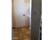 Compact bathroom featuring a toilet, shower/tub, and door leading to the outside at 6011 N 33Rd Ave, Phoenix, AZ 85017