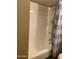 Clean bathroom features a shower/tub combo with tiled walls and a neutral color scheme at 6011 N 33Rd Ave, Phoenix, AZ 85017