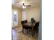 Inviting dining area featuring a marble table, seating for six, and a ceiling fan at 6011 N 33Rd Ave, Phoenix, AZ 85017