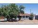 Charming single-story home with a well-maintained lawn and mature landscaping at 6011 N 33Rd Ave, Phoenix, AZ 85017