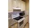 Kitchen features stainless steel appliances, white cabinets, and beautiful granite countertops at 6011 N 33Rd Ave, Phoenix, AZ 85017