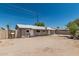 Spacious backyard featuring a large dirt area and a small concrete patio, ideal for outdoor activities and entertaining at 6334 N 37Th Ave, Phoenix, AZ 85019