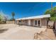 Backyard showing a paved patio and the exterior of the house at 6334 N 37Th Ave, Phoenix, AZ 85019