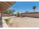 Spacious backyard with a brick fireplace and various plants at 6334 N 37Th Ave, Phoenix, AZ 85019