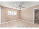 Bedroom featuring neutral paint, a ceiling fan, and tile flooring at 6334 N 37Th Ave, Phoenix, AZ 85019