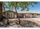 Charming single-story home with a mature tree and well-maintained front yard on a sunny day at 6334 N 37Th Ave, Phoenix, AZ 85019