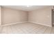 Spacious living room featuring tiled floors, neutral walls, and ample natural light at 6334 N 37Th Ave, Phoenix, AZ 85019