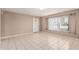 Bright living room featuring tile flooring, a white front door, and a sunny window at 6334 N 37Th Ave, Phoenix, AZ 85019