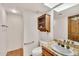 Bathroom featuring tile countertops, tile flooring and a wooden shelf at 7037 N 11Th Dr, Phoenix, AZ 85021
