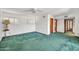 Bright bedroom with green carpet, plantation shutters and white walls at 7037 N 11Th Dr, Phoenix, AZ 85021