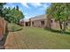 Exterior view of a home with a brick facade and lush green lawn at 7037 N 11Th Dr, Phoenix, AZ 85021