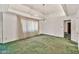 Large living room with green carpet, chandelier and bright lighting at 7037 N 11Th Dr, Phoenix, AZ 85021