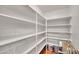 Walk-in pantry with white shelving for organized storage, offering ample space for food and supplies at 7037 N 11Th Dr, Phoenix, AZ 85021