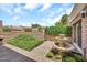 Tranquil outdoor patio with a tiered fountain and well-maintained landscaping, perfect for relaxation at 7037 N 11Th Dr, Phoenix, AZ 85021