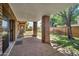 Covered patio with brick columns overlooking a well-maintained yard with a brick fence at 7037 N 11Th Dr, Phoenix, AZ 85021