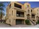 Charming multi-story home featuring a garage, inviting balconies, and manicured landscaping at 7122 W Ivanhoe St, Chandler, AZ 85226