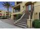 Inviting multi-level home showcases a covered balcony and a charming staircase leading to the entrance at 7122 W Ivanhoe St, Chandler, AZ 85226