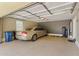 Spacious two-car garage with ample storage space and a modern car at 7122 W Ivanhoe St, Chandler, AZ 85226