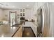 Well-lit, modern kitchen with a large island and stainless steel appliances at 7122 W Ivanhoe St, Chandler, AZ 85226