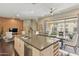 Spacious kitchen with a large island, stainless steel appliances, and access to an outdoor balcony at 7122 W Ivanhoe St, Chandler, AZ 85226