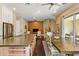 Open concept kitchen with a large island and stainless steel appliances flows into the living room area at 7122 W Ivanhoe St, Chandler, AZ 85226