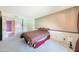 Bedroom with neutral carpet, wood trim, and a large bed, offering a comfortable retreat at 730 W Curry St, Chandler, AZ 85225