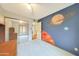 Unique bedroom with fun space themed wall art, carpet, and mirrored closet at 730 W Curry St, Chandler, AZ 85225