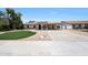 Attractive single-story home with solar panels, landscaped front yard, and a long driveway at 730 W Curry St, Chandler, AZ 85225