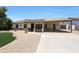 Cozy single-story home with front yard desert landscaping and covered carport at 730 W Curry St, Chandler, AZ 85225