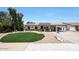 Charming single-story home with a well-manicured front yard and solar panels at 730 W Curry St, Chandler, AZ 85225